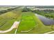 Aerial view showing a dog park and pond in a new community at 11628 Middle Fork Way, Parrish, FL 34219