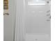 Clean white bathroom with shower/tub combo and stylish fixtures at 11628 Middle Fork Way, Parrish, FL 34219