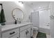 Modern bathroom with a vanity, stylish mirror, and updated fixtures at 11628 Middle Fork Way, Parrish, FL 34219