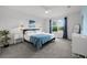 Spacious bedroom with large window, plush bed, and ample natural light at 11628 Middle Fork Way, Parrish, FL 34219