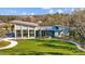 Modern community clubhouse with outdoor seating and green space at 11628 Middle Fork Way, Parrish, FL 34219