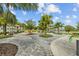 Community patio with seating and landscaping at 11628 Middle Fork Way, Parrish, FL 34219