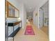 Bright entryway with tile floor, console table, and mirror at 11628 Middle Fork Way, Parrish, FL 34219