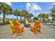 Fire pit area with colorful Adirondack chairs at 11628 Middle Fork Way, Parrish, FL 34219