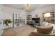 Bright home office featuring ample shelving and a comfy couch at 11628 Middle Fork Way, Parrish, FL 34219
