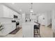Modern kitchen with white cabinets, stainless steel appliances, and large island at 11628 Middle Fork Way, Parrish, FL 34219