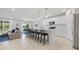 Modern kitchen with white cabinets, island, and stainless steel appliances at 11628 Middle Fork Way, Parrish, FL 34219
