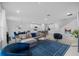 Open living room features comfortable seating and a view of the kitchen at 11628 Middle Fork Way, Parrish, FL 34219