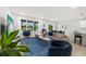 Spacious living room with comfortable seating and large windows at 11628 Middle Fork Way, Parrish, FL 34219