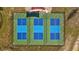 Aerial view of three well-maintained pickleball courts at 11628 Middle Fork Way, Parrish, FL 34219