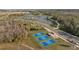 Aerial view of four pickleball courts and a covered seating area at 11628 Middle Fork Way, Parrish, FL 34219