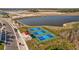 Four well-maintained pickleball courts near a pond at 11628 Middle Fork Way, Parrish, FL 34219