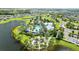 Aerial view of community pool, clubhouse, and surrounding landscape at 11628 Middle Fork Way, Parrish, FL 34219