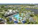 Aerial view of community resort-style pool and surrounding landscape at 11628 Middle Fork Way, Parrish, FL 34219