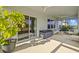 Relaxing screened porch with seating area and ceiling fan at 11628 Middle Fork Way, Parrish, FL 34219