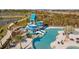 Aerial view of a community waterpark with slides and a pool at 11628 Middle Fork Way, Parrish, FL 34219