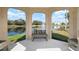 Serene gazebo with pond views and seating at 1214 Berkshire Cir, Venice, FL 34292