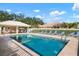 Community pool with lounge chairs and gazebo at 1214 Berkshire Cir, Venice, FL 34292