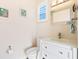 Powder room with pedestal sink and updated fixtures at 12334 Baypointe Ter, Cortez, FL 34215
