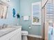 Small bathroom with a shower, toilet and vanity at 12334 Baypointe Ter, Cortez, FL 34215