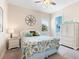 Bedroom with coastal decor and ensuite bathroom access at 12334 Baypointe Ter, Cortez, FL 34215