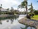 Beautiful view of a tranquil canal with lush landscaping at 12334 Baypointe Ter, Cortez, FL 34215