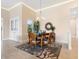 Bright dining area with wood table and chairs, decorative rug, and chandelier at 12334 Baypointe Ter, Cortez, FL 34215