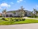 Luxury home with stone accents and a three-car garage at 12334 Baypointe Ter, Cortez, FL 34215