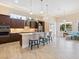 Modern kitchen featuring granite counters, stainless steel appliances, and an island at 12334 Baypointe Ter, Cortez, FL 34215