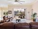 Open concept living room with sliding doors to pool area at 12334 Baypointe Ter, Cortez, FL 34215