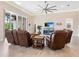 Spacious living area with leather furniture and large TV at 12334 Baypointe Ter, Cortez, FL 34215