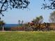 Relaxing park view with a cyclist resting by the water at 12334 Baypointe Ter, Cortez, FL 34215
