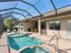 Resort-style pool and spa with screened enclosure at 12334 Baypointe Ter, Cortez, FL 34215
