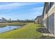 Beautiful backyard with a pond view from the building at 12410 Osorio Ct # 101, Sarasota, FL 34238