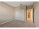 Spacious bedroom with a closet and carpeted flooring at 12410 Osorio Ct # 101, Sarasota, FL 34238