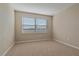 Neutral-toned bedroom with carpet and a window view at 12410 Osorio Ct # 101, Sarasota, FL 34238