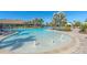 Large community pool with water fountains, lounge chairs, and resort-style amenities at 12410 Osorio Ct # 101, Sarasota, FL 34238