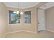 Bright dining area with a chandelier fixture, tiled floors and a view to the front of the property at 12410 Osorio Ct # 101, Sarasota, FL 34238