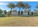 The Esplanade/Legacy Estates entrance sign is surrounded by green lawn and landscaping at 12410 Osorio Ct # 101, Sarasota, FL 34238