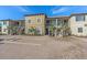 Attractive townhome exteriors showcasing manicured landscaping, paved parking, and inviting entrances at 12410 Osorio Ct # 101, Sarasota, FL 34238
