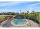 Inviting hot tub surrounded by lush landscaping and a relaxing atmosphere at 12410 Osorio Ct # 101, Sarasota, FL 34238
