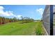 Spacious backyard with pond view and lush landscaping at 12681 Palatka Dr, Venice, FL 34293