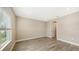 Spacious bedroom with wood-look floors and access to a bathroom at 12681 Palatka Dr, Venice, FL 34293