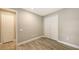 Bright bedroom with wood-look floors and double-door closet at 12681 Palatka Dr, Venice, FL 34293
