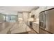 Modern kitchen with white cabinets, quartz counters, and island at 12681 Palatka Dr, Venice, FL 34293