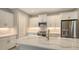 Modern kitchen featuring white cabinets, quartz countertops, and stainless steel appliances at 12681 Palatka Dr, Venice, FL 34293