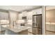 Modern kitchen with white cabinets and quartz countertops at 12681 Palatka Dr, Venice, FL 34293