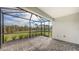 Screened patio with paver floor and view of backyard at 12681 Palatka Dr, Venice, FL 34293