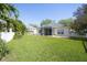 Spacious backyard with grassy area and screened patio at 12732 Rockrose Gln, Lakewood Ranch, FL 34202