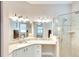 Elegant bathroom with a granite vanity and walk-in shower at 12732 Rockrose Gln, Lakewood Ranch, FL 34202